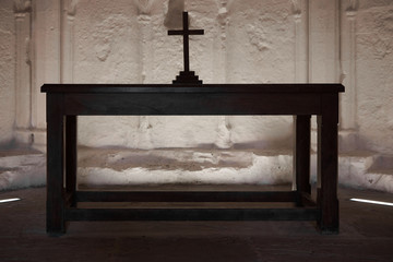 Cross on the table .