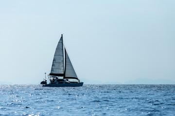 Fototapeta premium Sailing ship luxury yacht with white sails in the Sea.