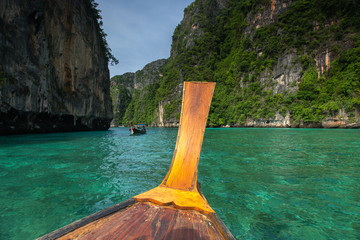 Long boat and blue water at Maya bay in Phi Phi Island, Krabi Thailand.