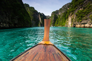 Long boat and blue water at Maya bay in Phi Phi Island, Krabi Thailand.