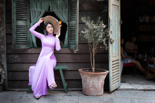 Beautiful vietnamese woman in Ao Dai white-traditional dress of vietnam, Ho Chi Minh city Vietnam