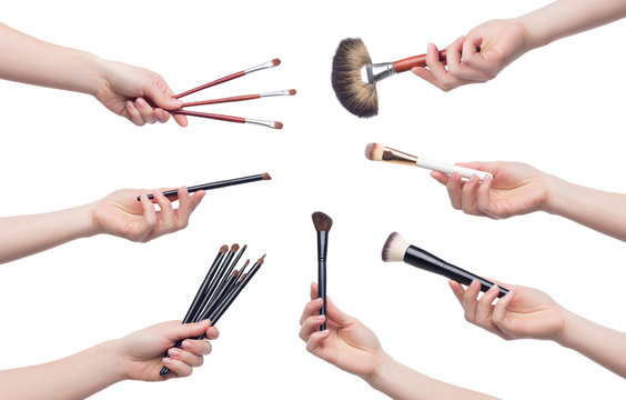 Set of cosmetic brushes for makeup in female hands