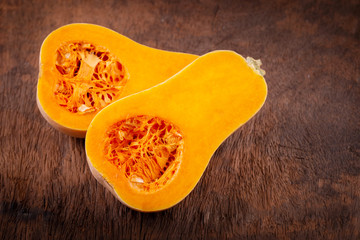 butternut squash over old wood background