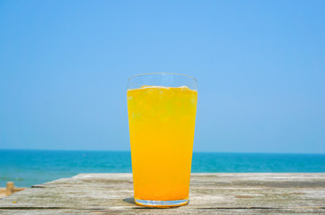 Orange juice drinking on the beach.  ビーチで飲むオレンジジュース