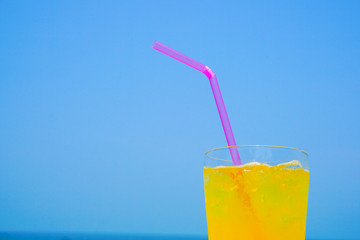 Orange juice drinking on the beach.  ビーチで飲むオレンジジュース