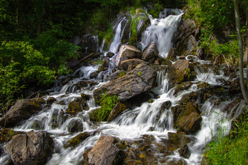 Fototapeta premium Upper Peninsula Michigan Roadside Waterfall. Beautiful Fumee Falls outside of Iron Mountain, Michigan is located at a roadside park along US 2.