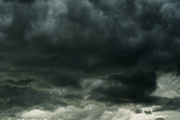 Naklejka na ściany i meble Storm clouds dramatic with black clouds and moody sky, Motion dark sky before rainy