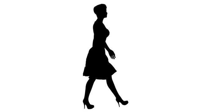 Black silhouette of a walking girl. Alpha channel. Alpha matte. FullHD.