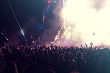 Fototapeta na wymiar Concert lights and crowd background 