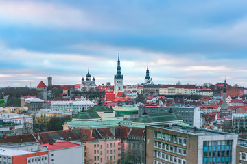 Obraz premium Aerial panoramic cityscape with Medieval Old Town illuminated with Saint Nicholas Church, Cathedral Church of Saint Mary and Alexander Nevsky Cathedral in Tallinn in the evening, Estonia