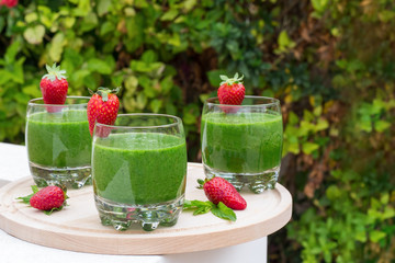 Healthy eating, food, diet, detox concept with green smoothie on wooden board