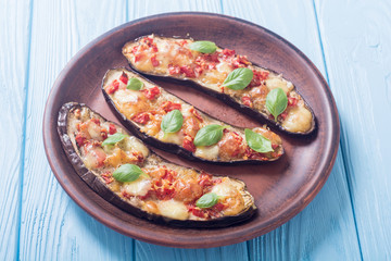 Eggplant with tomatoes , cheese and basil