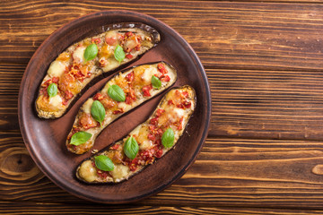 Eggplant with tomatoes , cheese and basil