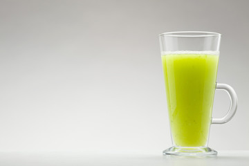 green smoothie on white background
