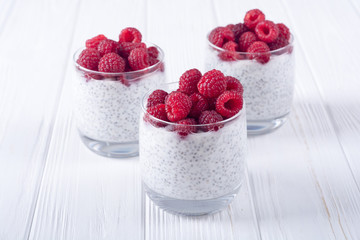 Chia pudding in glass with raspberry