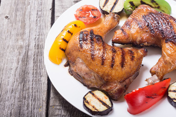 Grilled chicken legs with vegetables