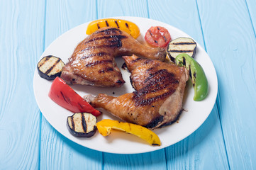 Grilled chicken legs with vegetables