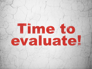 Obraz premium Timeline concept: Red Time to Evaluate! on textured concrete wall background