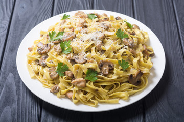 Pasta tagliatelle with chicken meat and mushroom