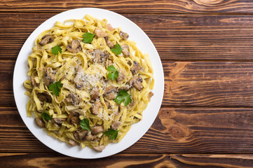Pasta tagliatelle with chicken meat and mushroom