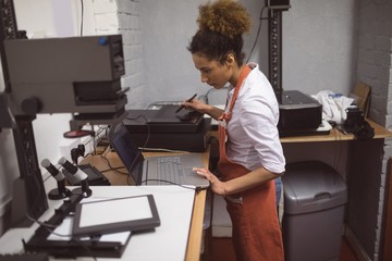 Female photographer developing photos