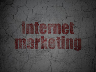 Advertising concept: Red Internet Marketing on grunge textured concrete wall background