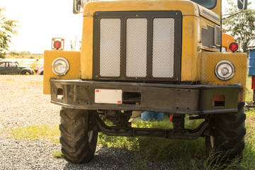 front grill and head light of old rusted truck