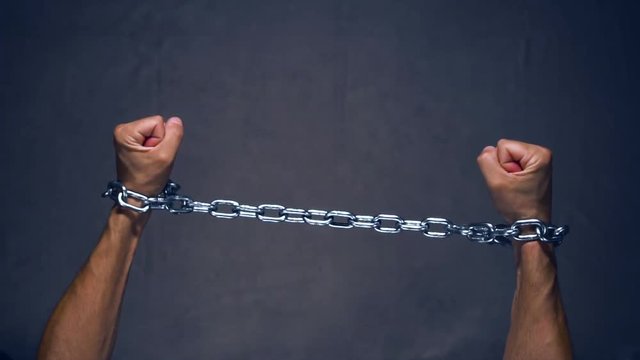 Freedom, concept of free man, broken chain in slow motion