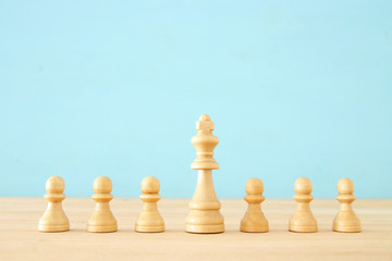 image of wooden chess ponds over table ,building a strong team, human resources and management concept.