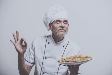 Chef Enjoys Scent of Pizza.