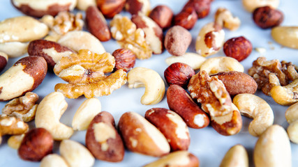 group of mixed nuts on white plate
