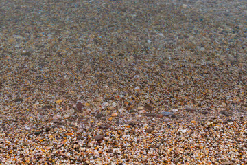 Sea stones on the seashore in the summer