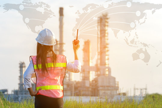 Asian women work experience and professional occupational engineer electrician with safety control at power plant energy industry and construction , background map world. Engineer Concept
