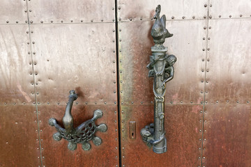 Door handle in The High Cathedral of Saint Peter in Trier, Germany.