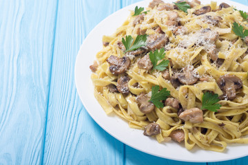 Pasta tagliatelle with chicken meat and mushroom