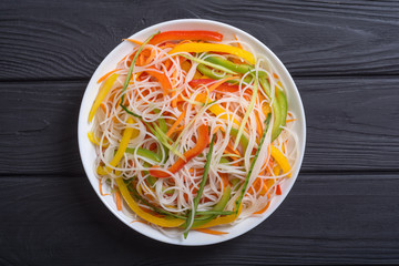 Salad from rice noodles with vegetables
