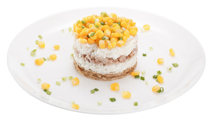 Fish salad with riсe, egg and corn is served on a slice of rye bread.  Isolated on white background.