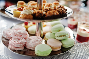 Close-up photo of delicious desserts on the wedding buffet.
