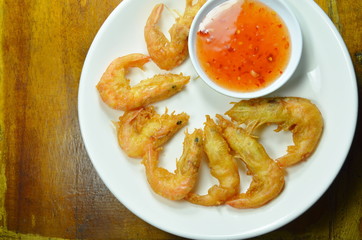 crispy fried shrimp with flour arranging and sweet sauce on plate