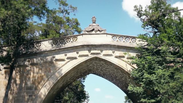 Old Stone Bridge At Laxenburg Castle In Austria Shot From The Moving Boat