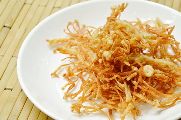 fried crispy needle mushroom on plate