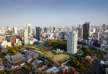 Naklejka premium cityscape of tokyo city skyline in Aerial view with skyscraper, modern business office building with blue sky background in Tokyo metropolis city, Japan.