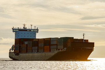 Black container ship underway