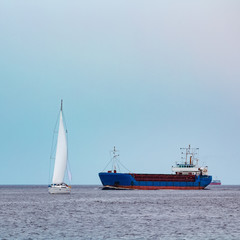 Blue cargo ship underway