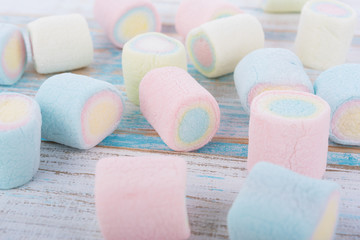 marshmallows on wooden background. top view