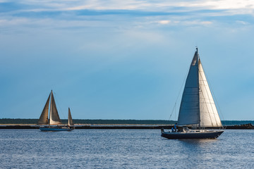 Blue sailboat at river