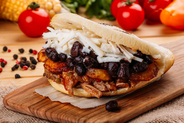 The typical Venezuelan Arepa called Pabellon, which has seasoned minced meat, fried plantain, black beans and white cheese