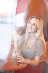 Beautiful Young Woman with Fruit smoothie