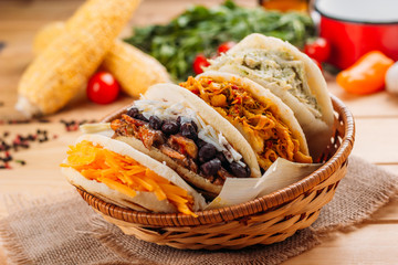 Combination of the typical South American Arepas in a woven basket