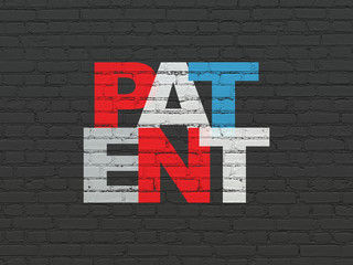 Law concept: Painted multicolor text Patent on Black Brick wall background